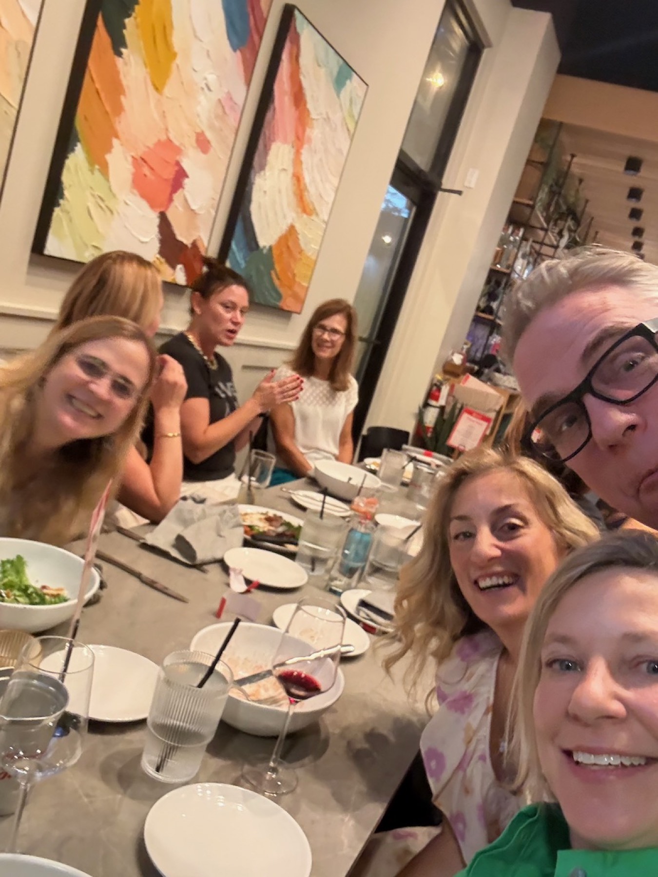 Table selfie mid-laugh at the first Dinner Club.