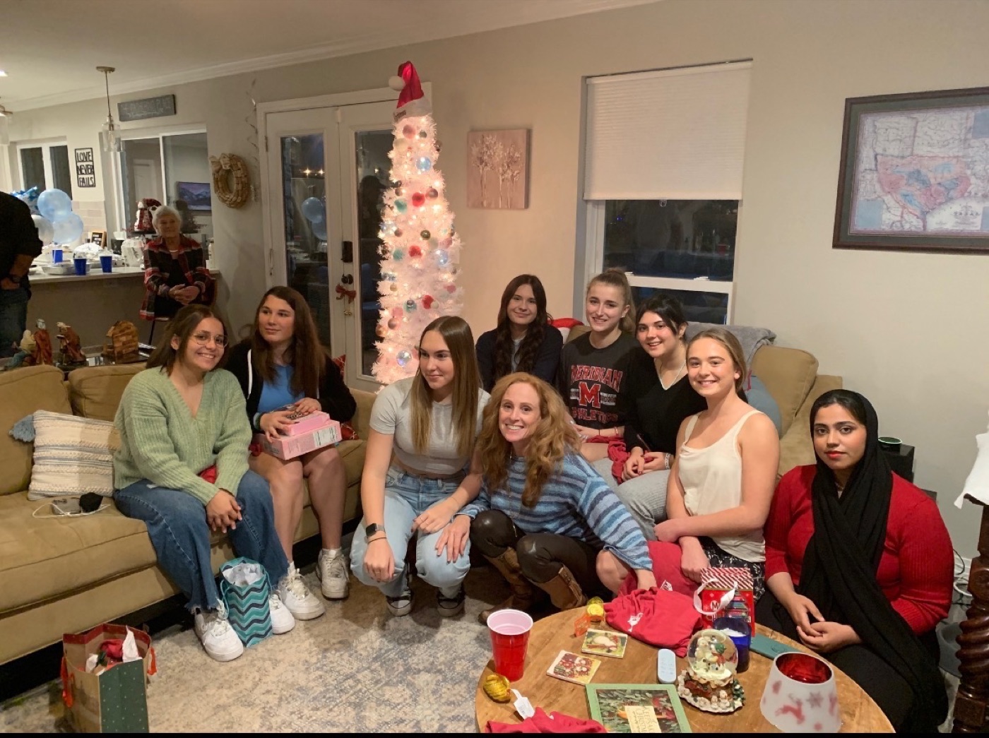 Audrey with a group of foreign exchange students at a holiday gathering