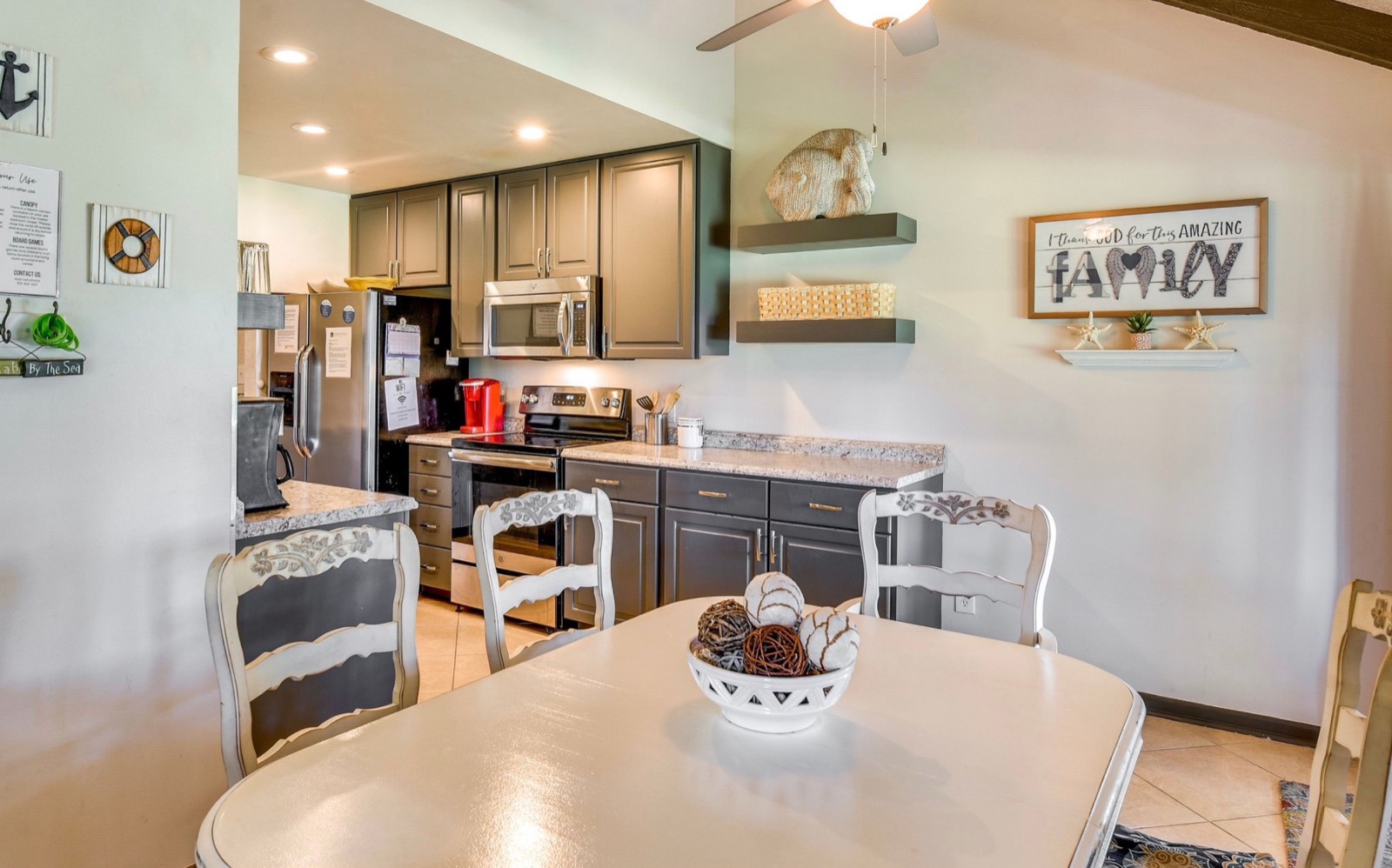 Kitchen with stainless appliances and dining table