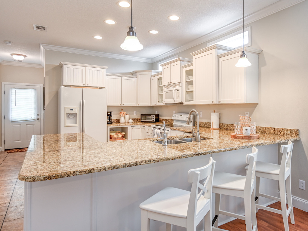Kitchen with granite counters and a breakfast bar